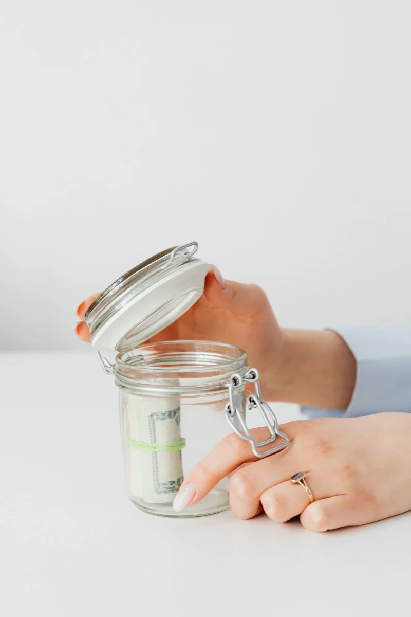 Coins and a savings jar illustrating high-yield savings accounts in Canada
